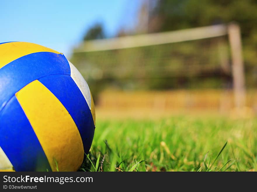 Ball on the grass over a blue sky