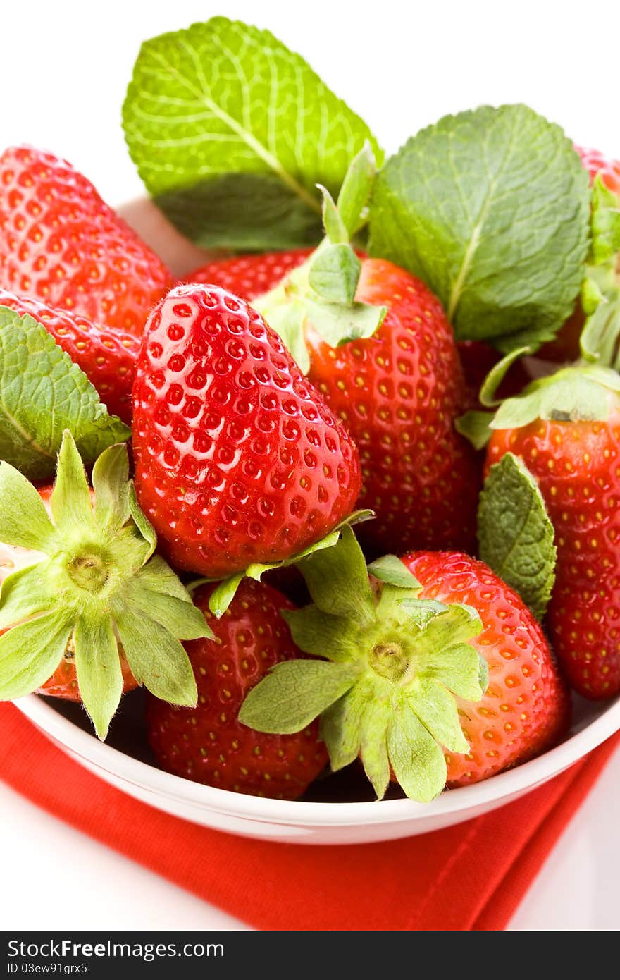 Photo of delicious red strawberries with mint leaves