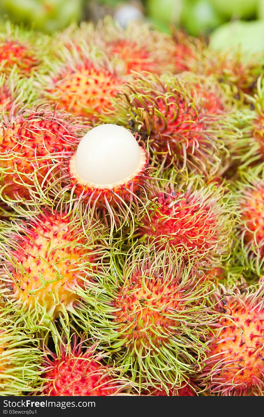 Tropical Fruit,white pulp rambutan among red rambutan.