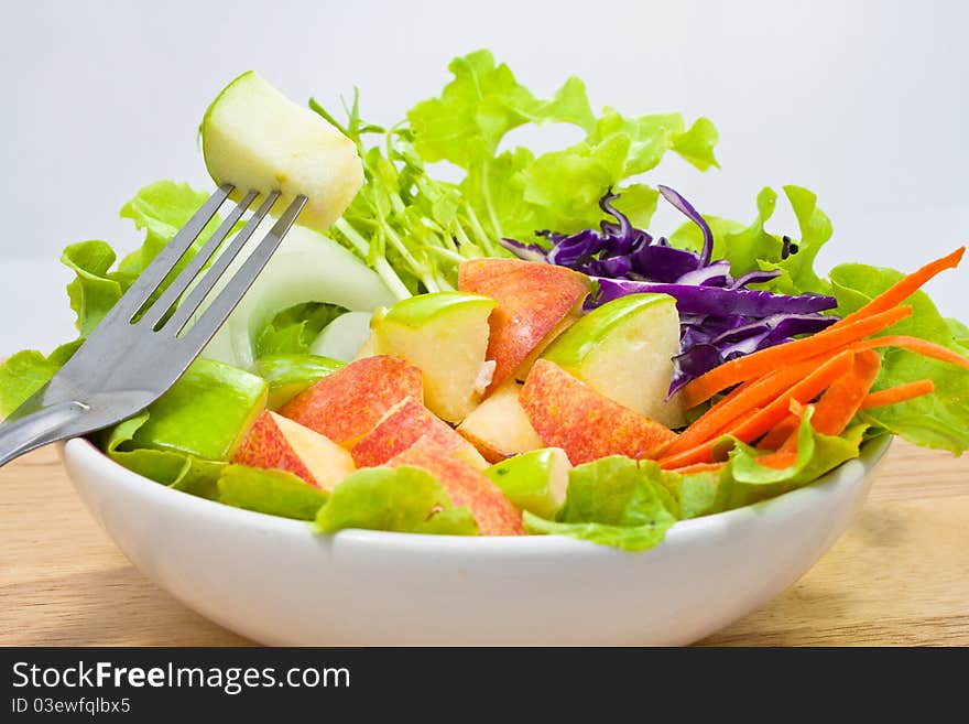 Apple salad in white bowl