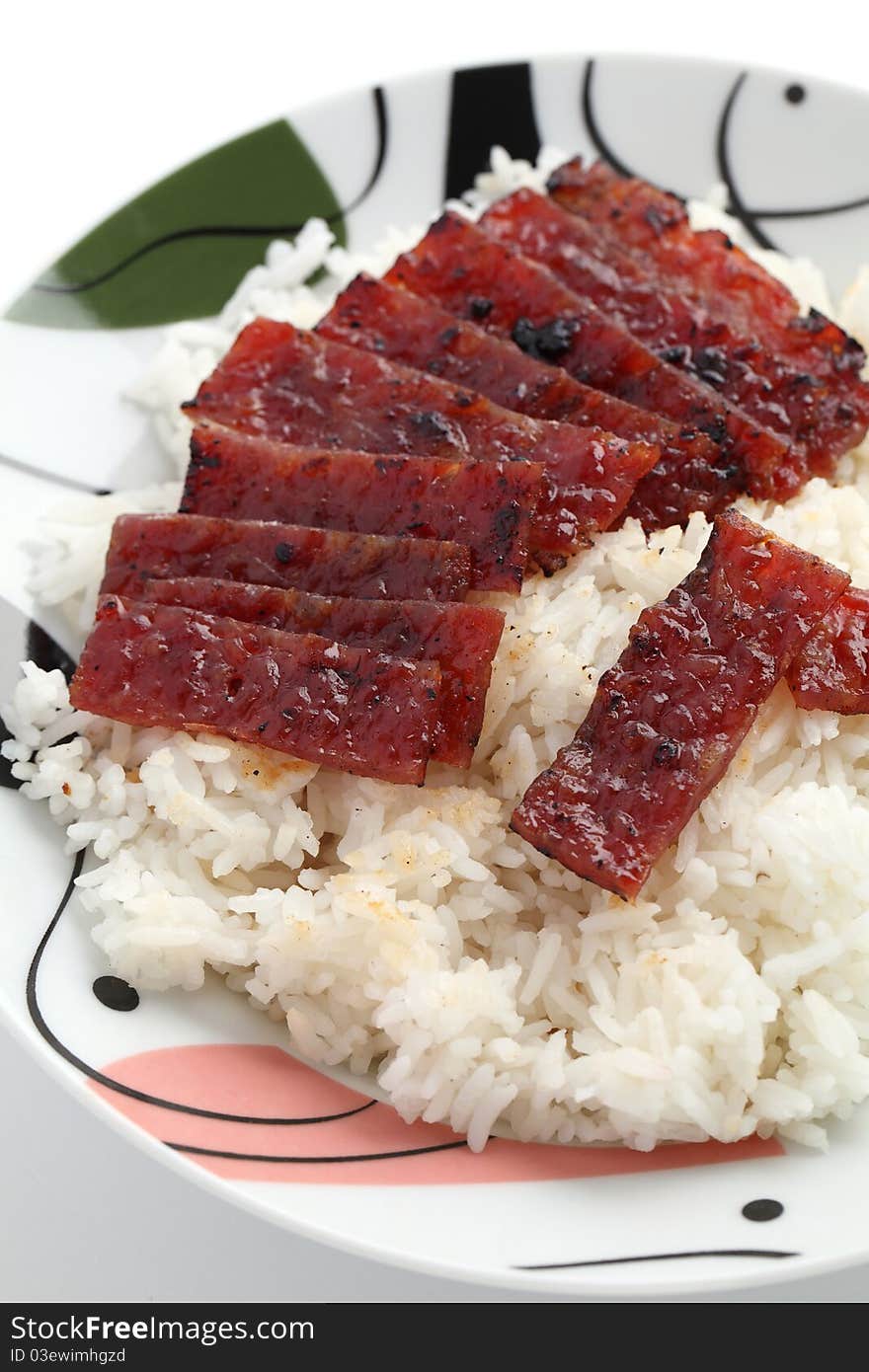 Close up of barbecue meat rice on white plate isolated over white background.