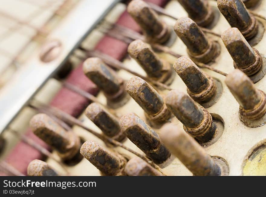 Close-up, rusty frets, old piano