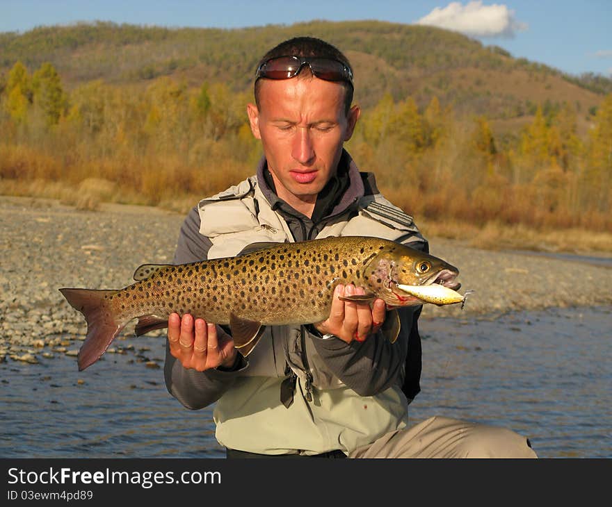 Fishing - fisherman catched big trout