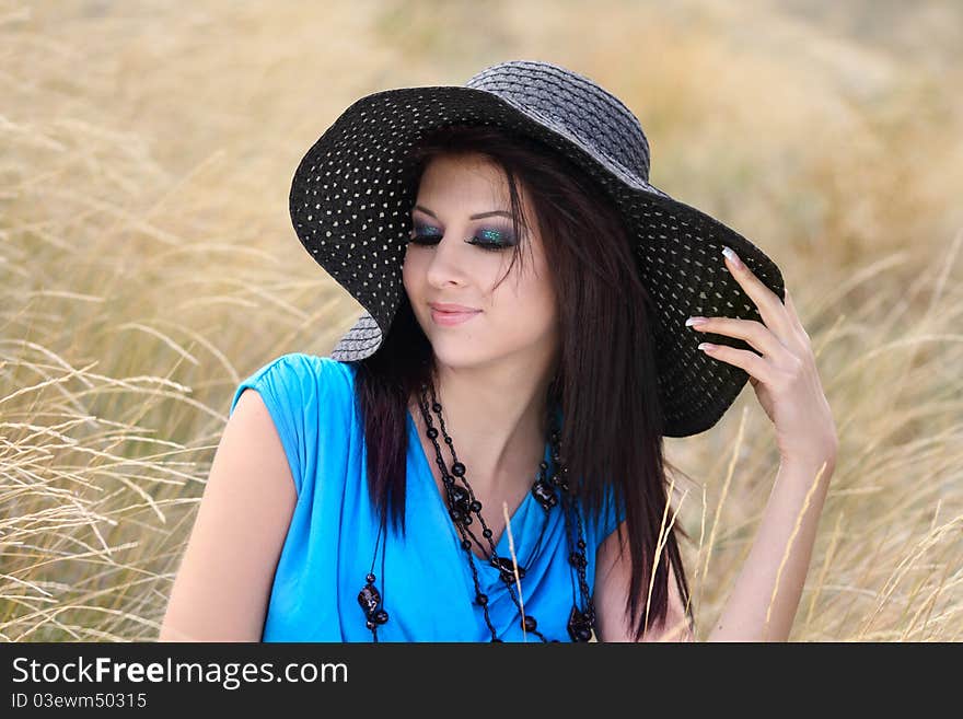 Portrait of a young girl in stylish bonnet with beautiful make-up. Portrait of a young girl in stylish bonnet with beautiful make-up