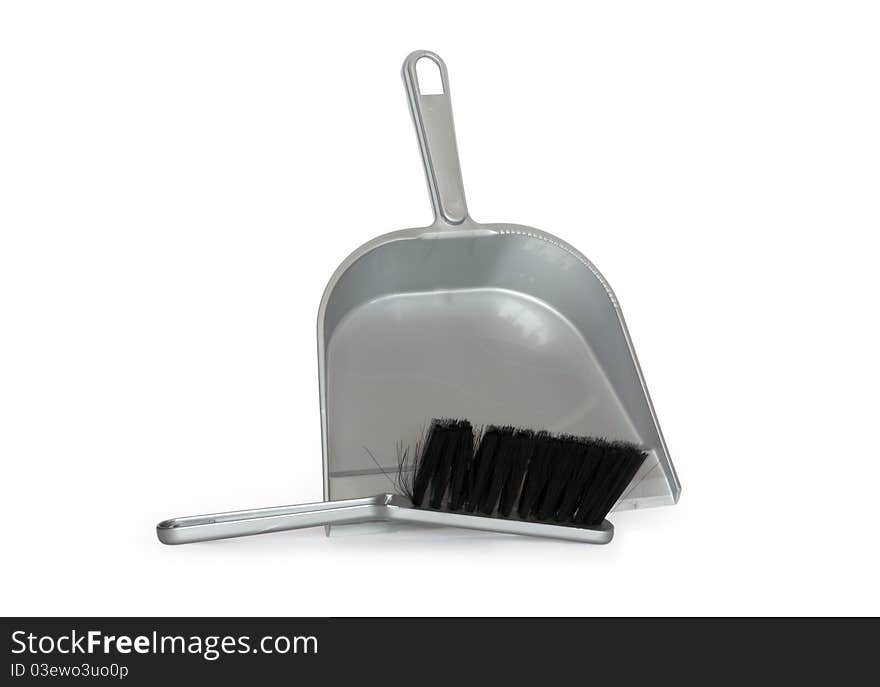 Gray plastic dustpan and scrub isolated on white background with clipping path. Gray plastic dustpan and scrub isolated on white background with clipping path