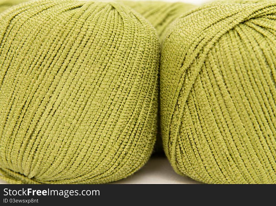 The green yarn skeins isolated on white