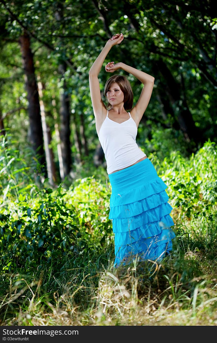 Beautiful girl in a summer forest