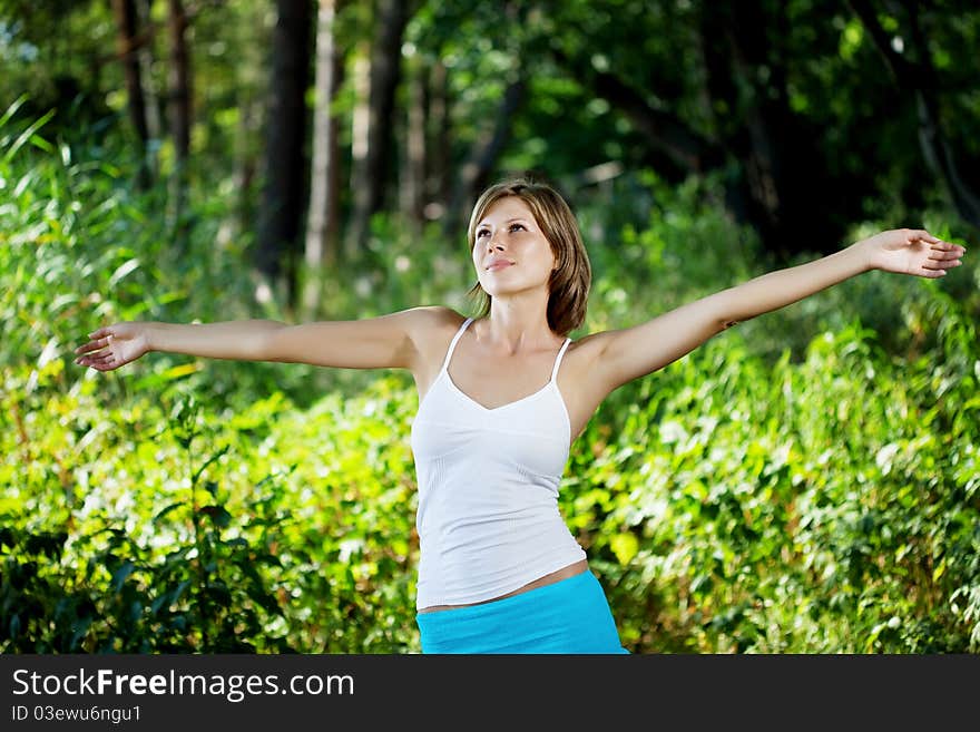 Beautiful girl in a summer forest