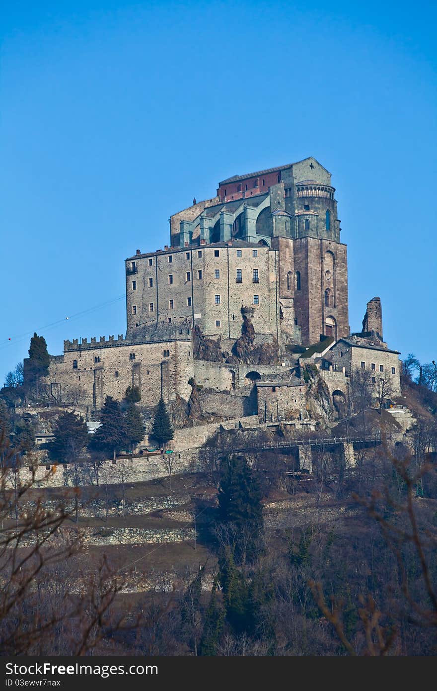 Abbey of 11st century, Piedmont region, Italy. The church, whose construction lasted for many years, is characterized by the unusual position and architecture. Abbey of 11st century, Piedmont region, Italy. The church, whose construction lasted for many years, is characterized by the unusual position and architecture.