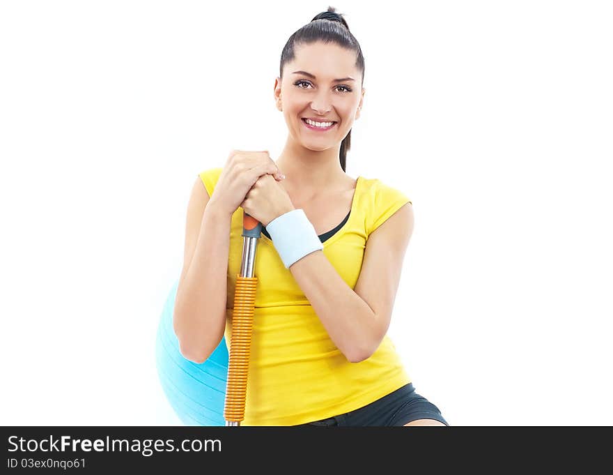 Young beautiful woman during fitness with expander. Young beautiful woman during fitness with expander