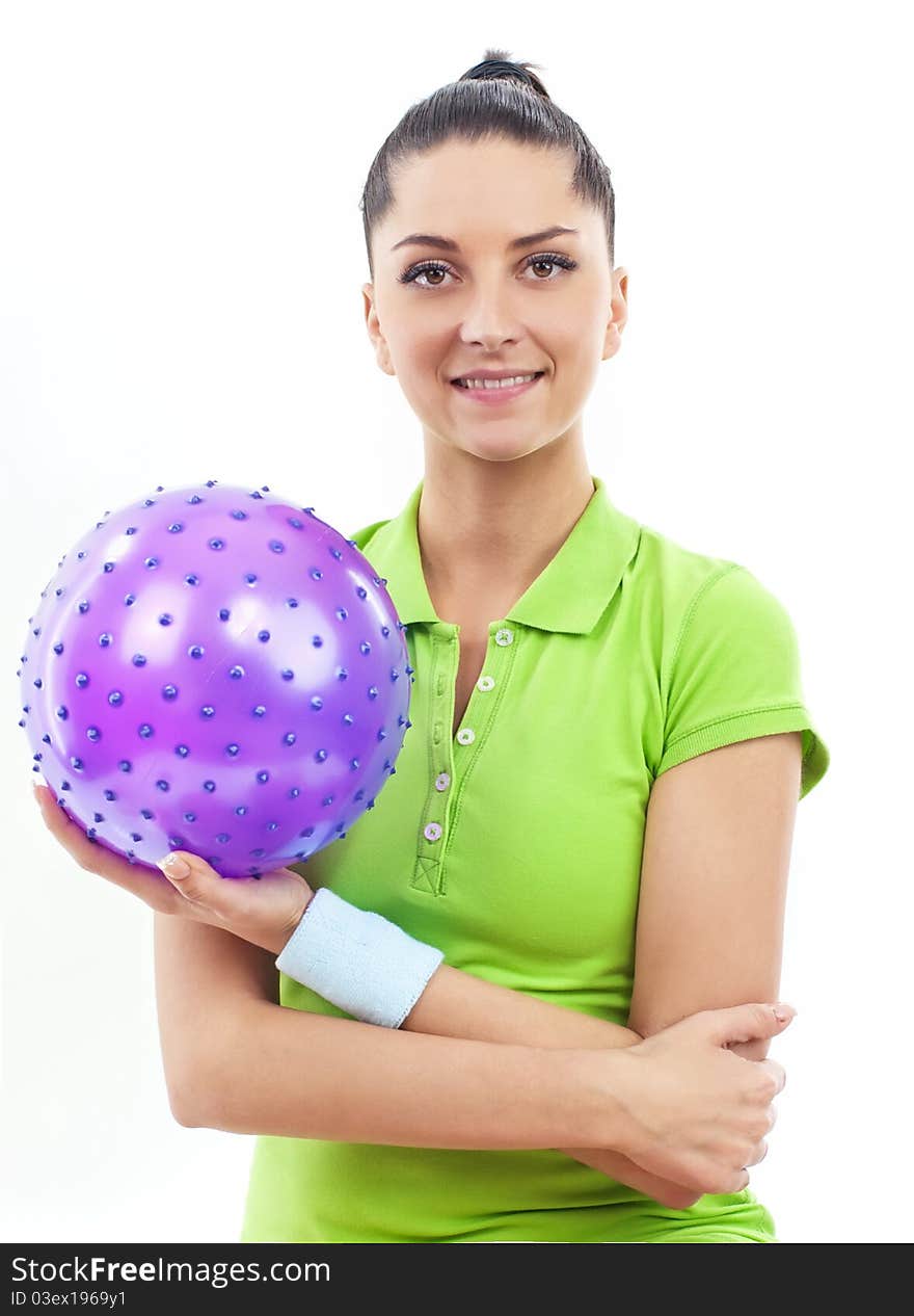 Smiling brunette woman with rubber ball, isolated. Smiling brunette woman with rubber ball, isolated