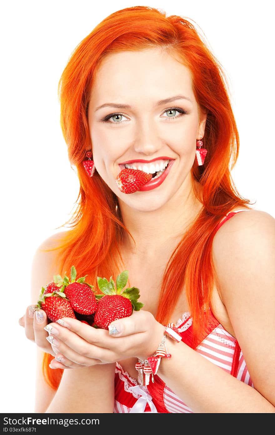 Portrait of redhead woman holding and biting strawberry. Portrait of redhead woman holding and biting strawberry