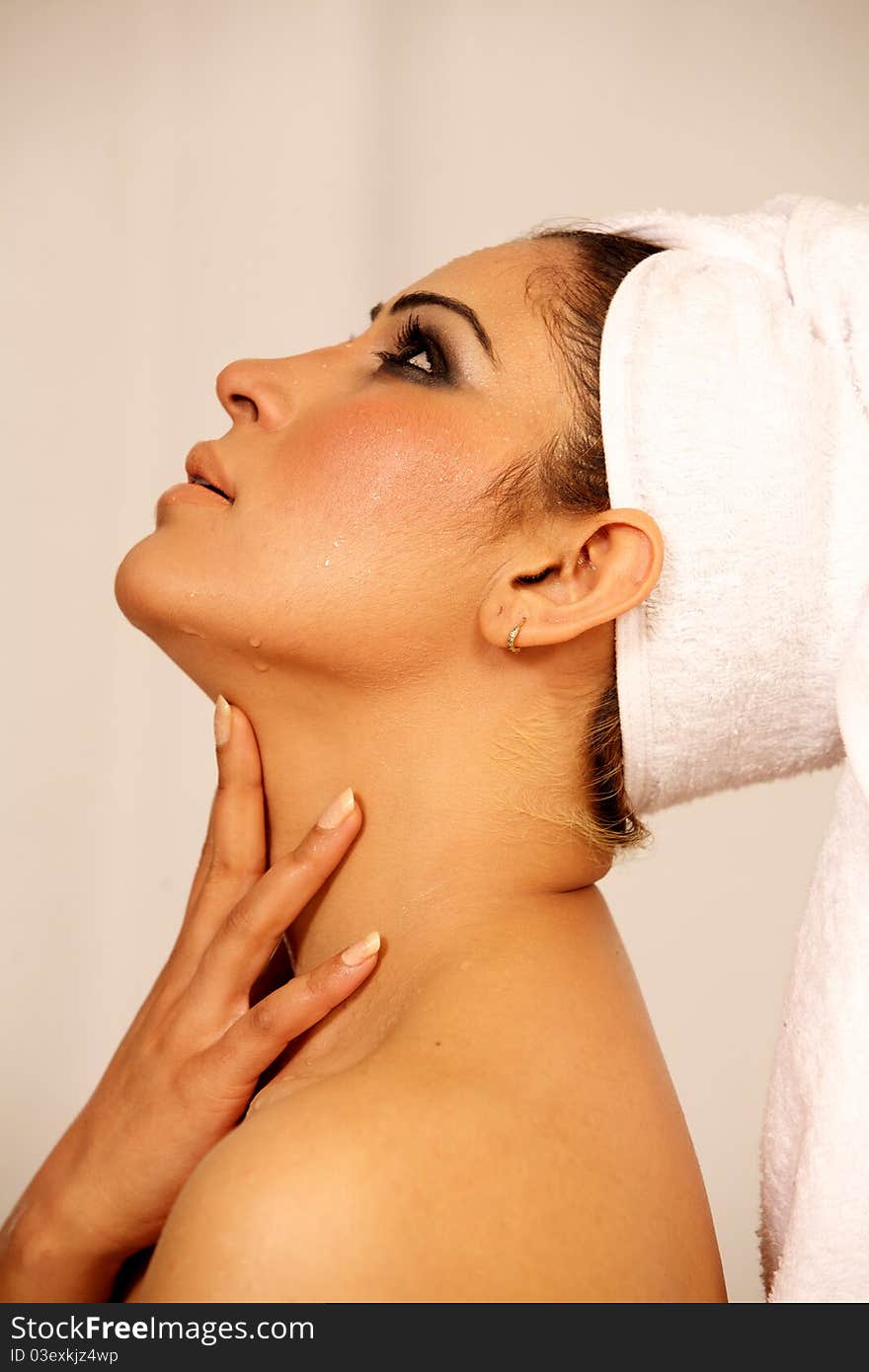 Closeup portrait of young beautiful woman after bath