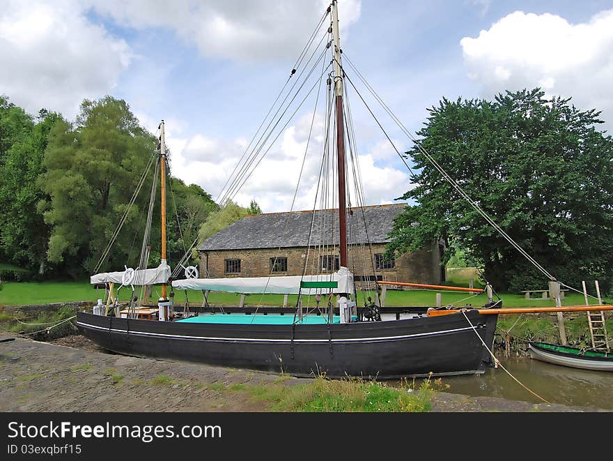 A Vintage Sailing Barge by a river in Devon