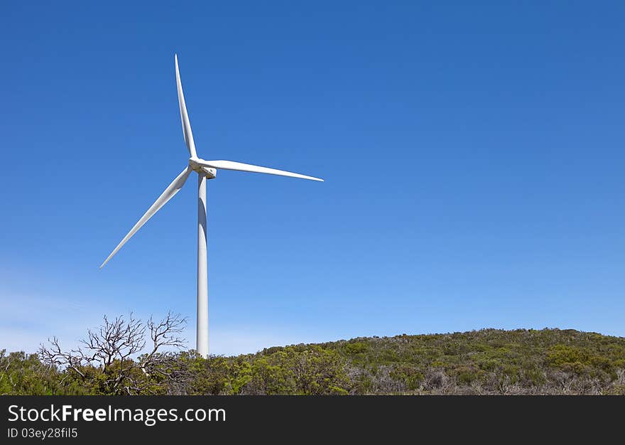 Windmill On Top Of A Hillside