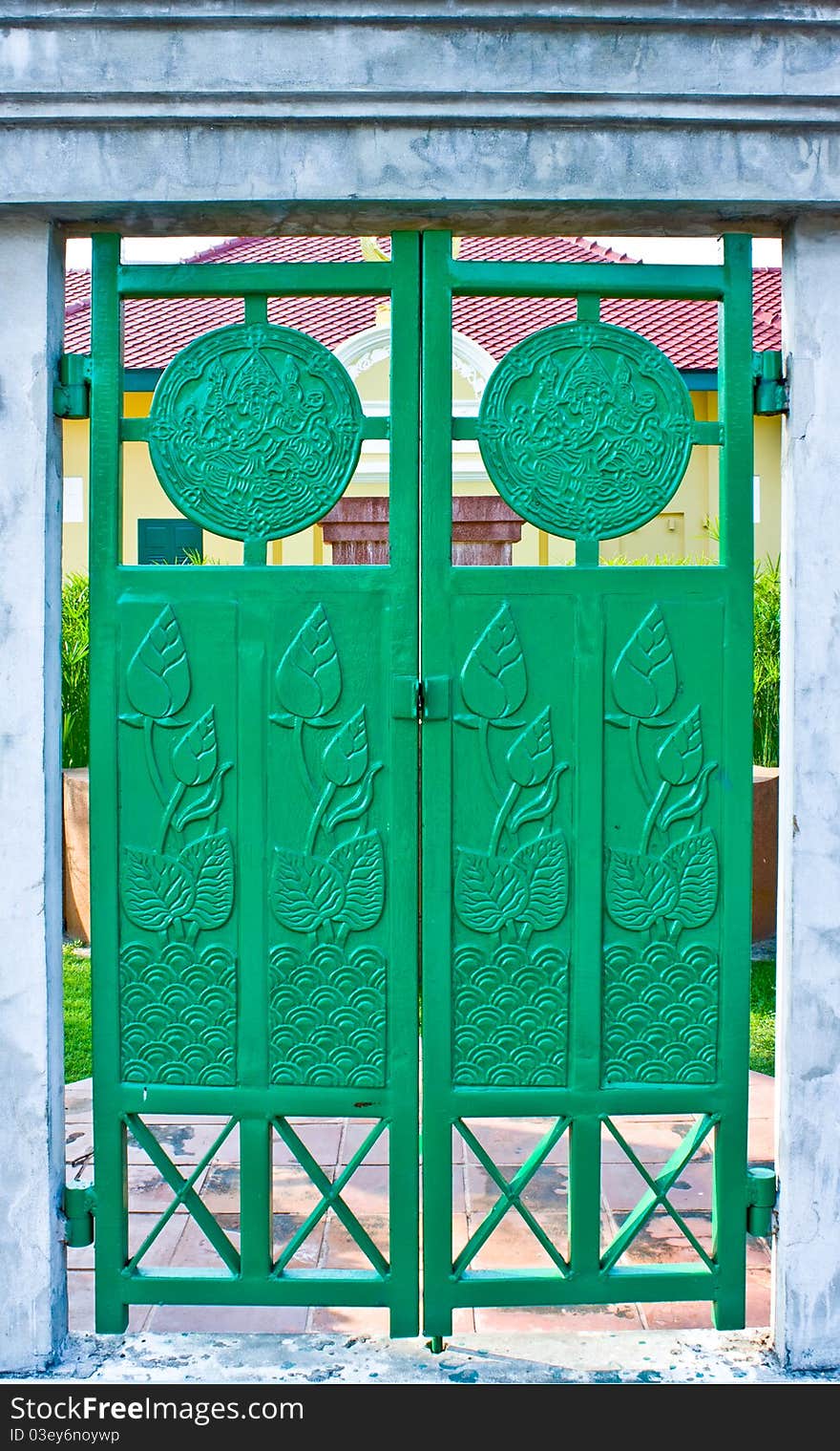 Green iron door with lotus picture