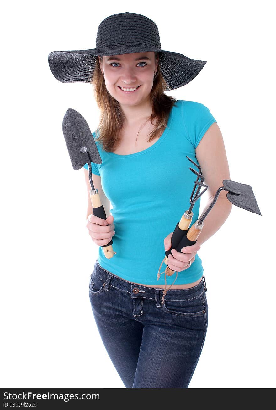Woman holding three gardening tools. Woman holding three gardening tools