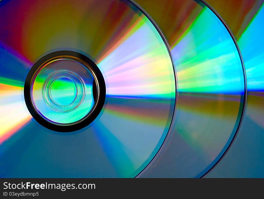 Several compact discs with a beautiful reflection. Several compact discs with a beautiful reflection