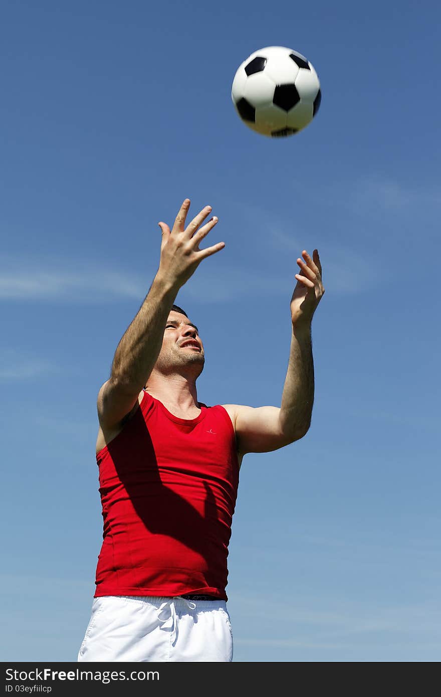 Man with ball in the sky