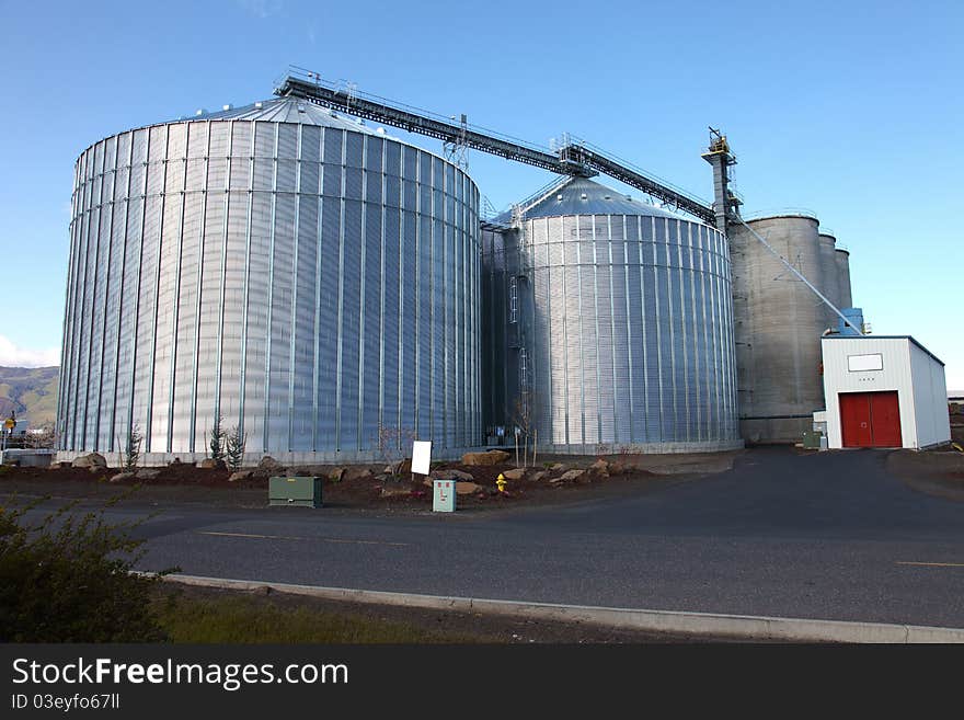 Large twin silos near the port of the city The Dalles in Oregon. Large twin silos near the port of the city The Dalles in Oregon.