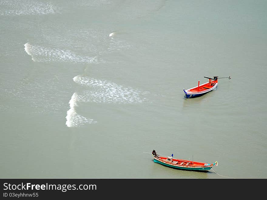 Two fishing boats floating in the sea