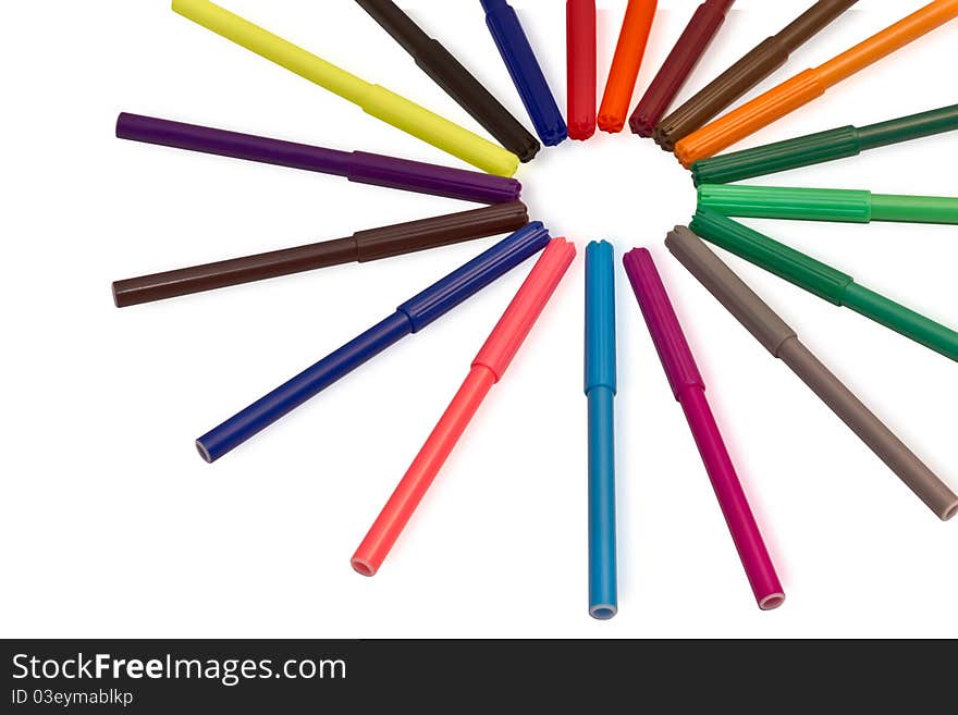 Multi-colored markers in the form of the sun on a white background