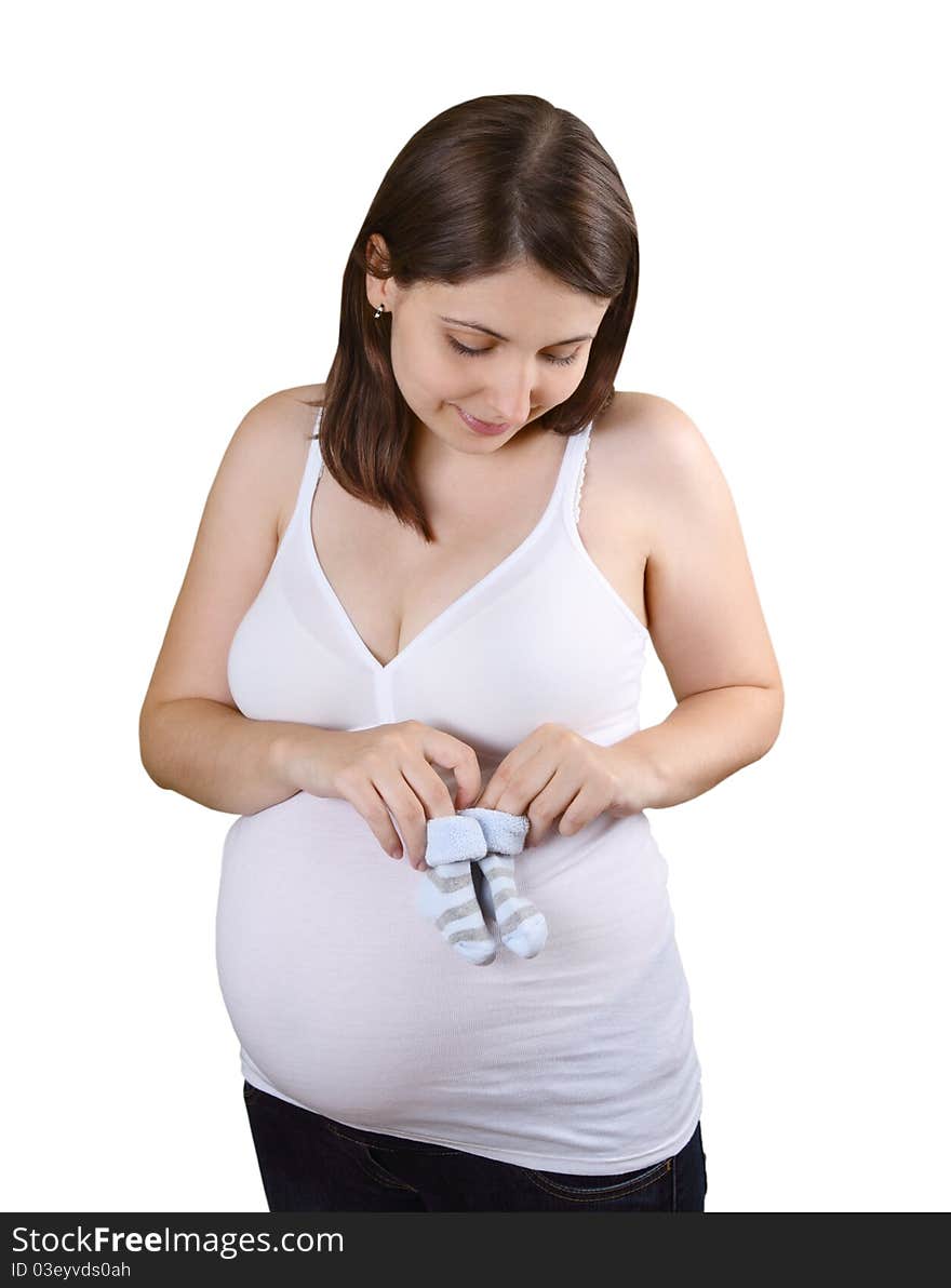 Smiling young pregnant woman  with blue striped baby socks