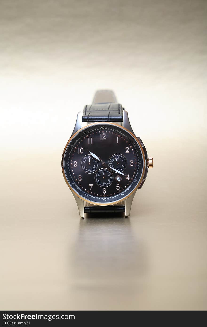 Modern wristwatch standing on nice silver background. Modern wristwatch standing on nice silver background