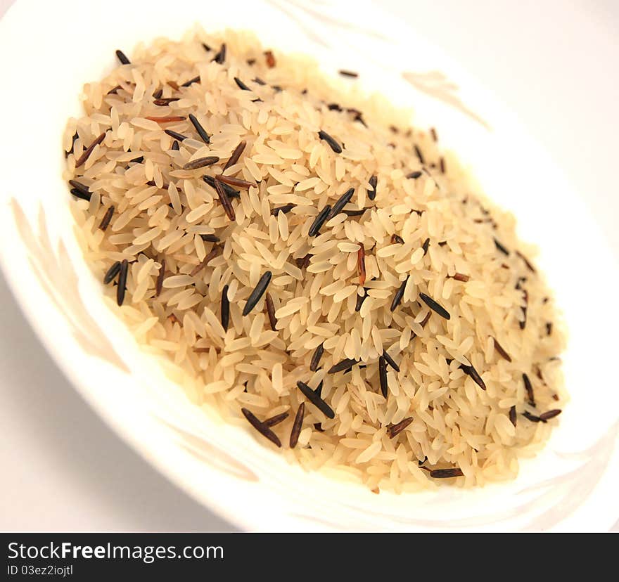 Wild rice and basmati rice isolated on white background. Wild rice and basmati rice isolated on white background