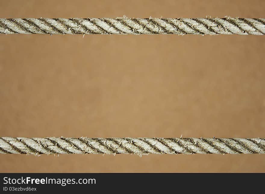 Rope on sand as background