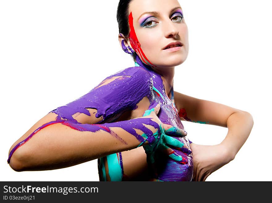 Brunette with colorful body painting over white background. Brunette with colorful body painting over white background