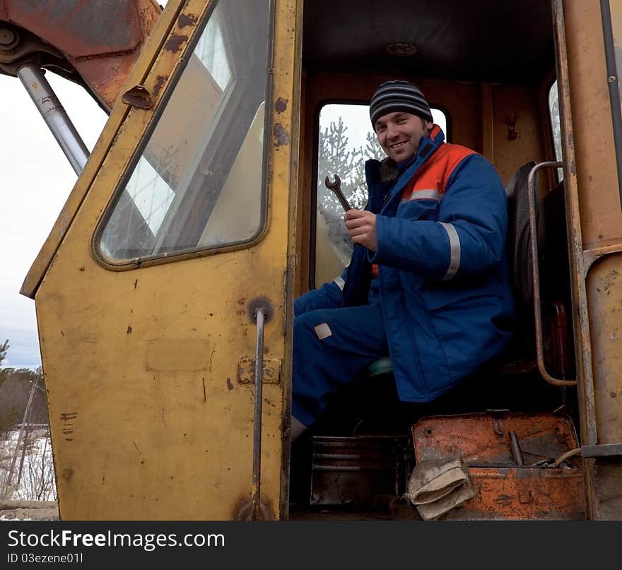 Machinist Excavator With A Wrench In His Hand