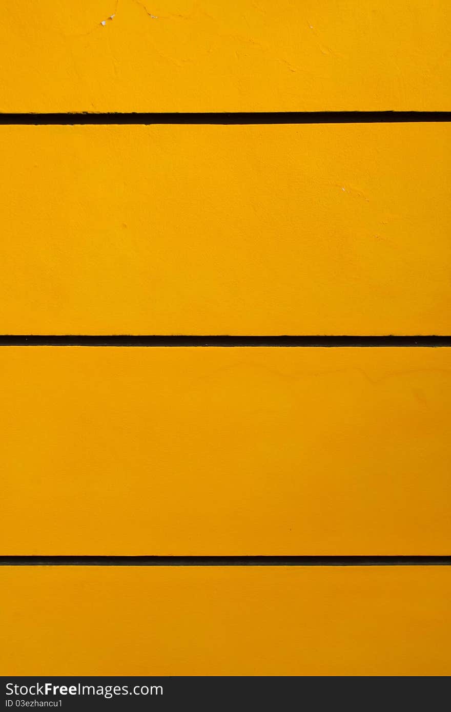 The wall, yellow, black texture. The wall, yellow, black texture