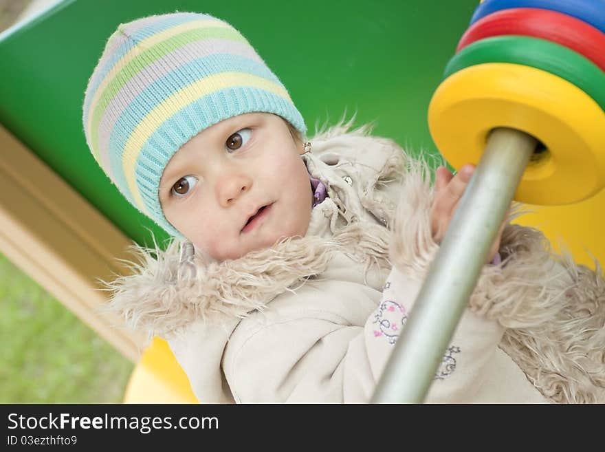 The small child plays open air in the spring. The small child plays open air in the spring