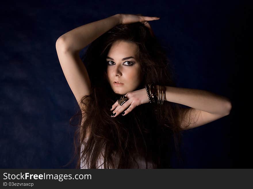 The beautiful mystical women on the dark blue background.