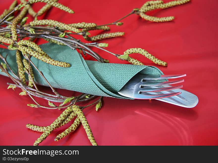 Holiday table setting with fork, knife, napkin, plate. Holiday table setting with fork, knife, napkin, plate