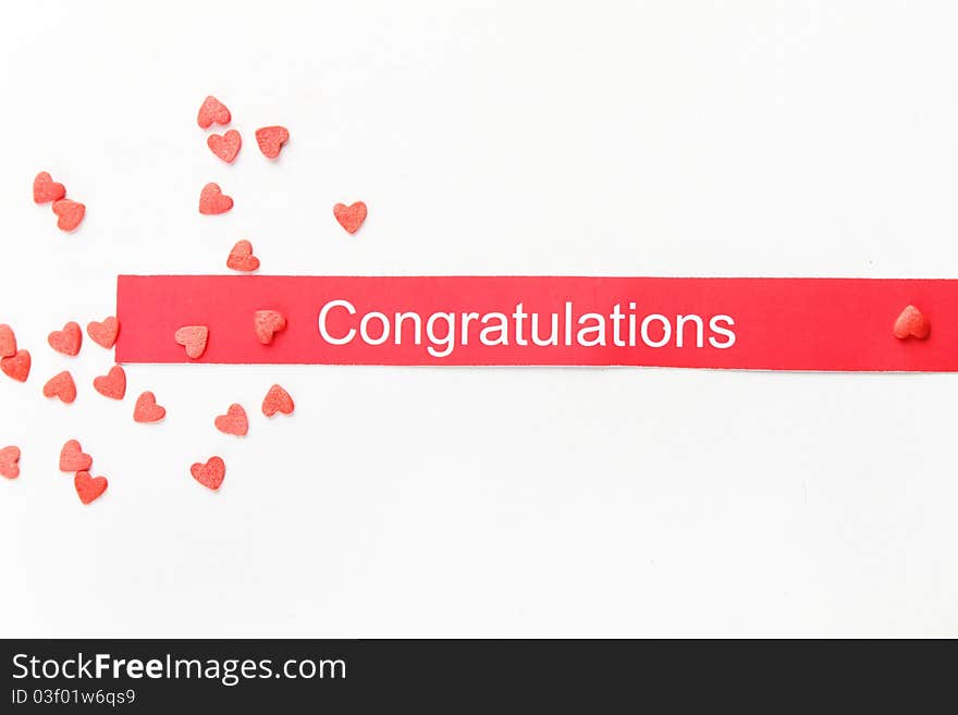 On the background of a large number of red hearts. Tasty Baking decorations. Card with text congratulation. On the background of a large number of red hearts. Tasty Baking decorations. Card with text congratulation