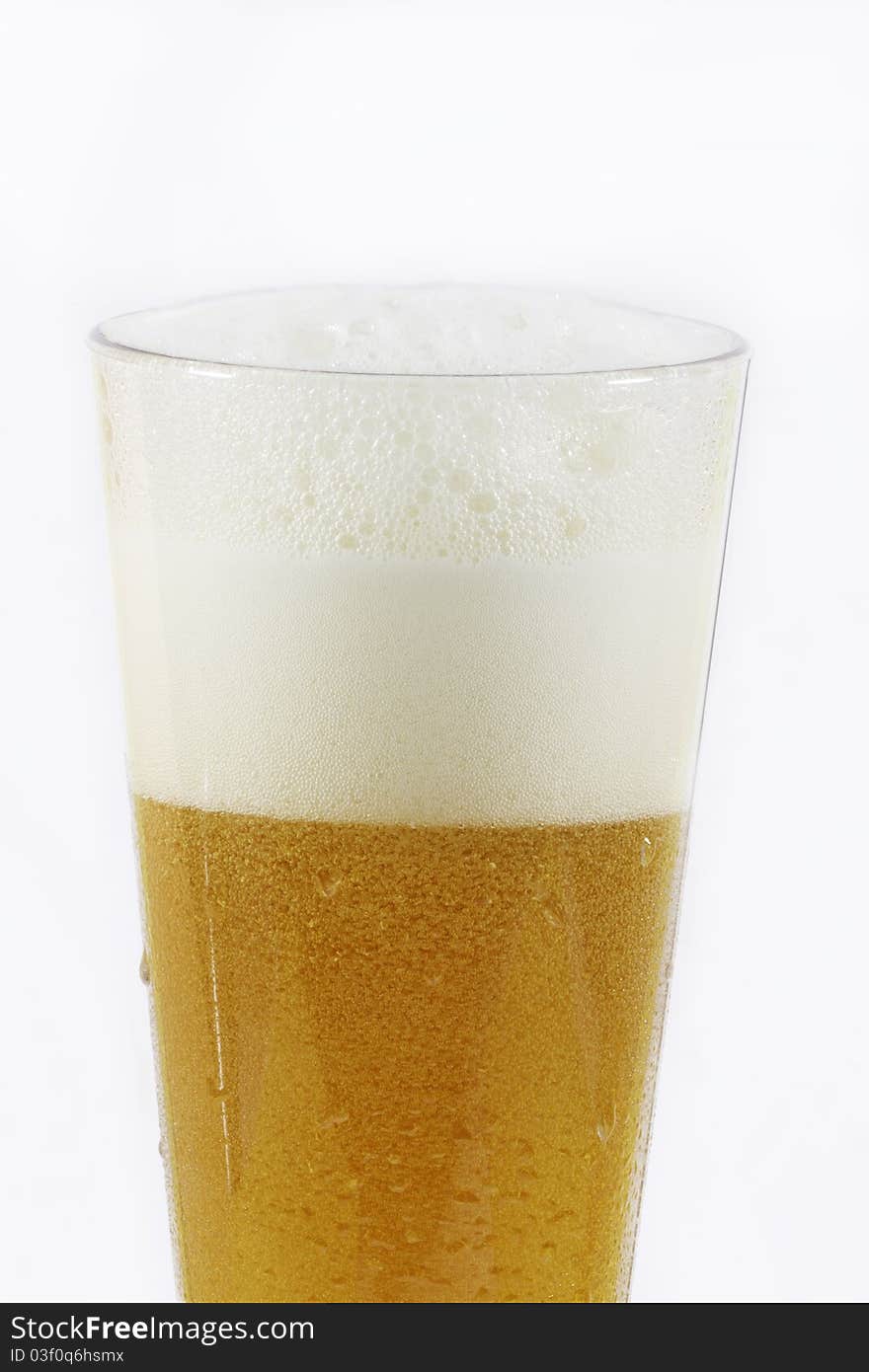 Glass of beer on white background