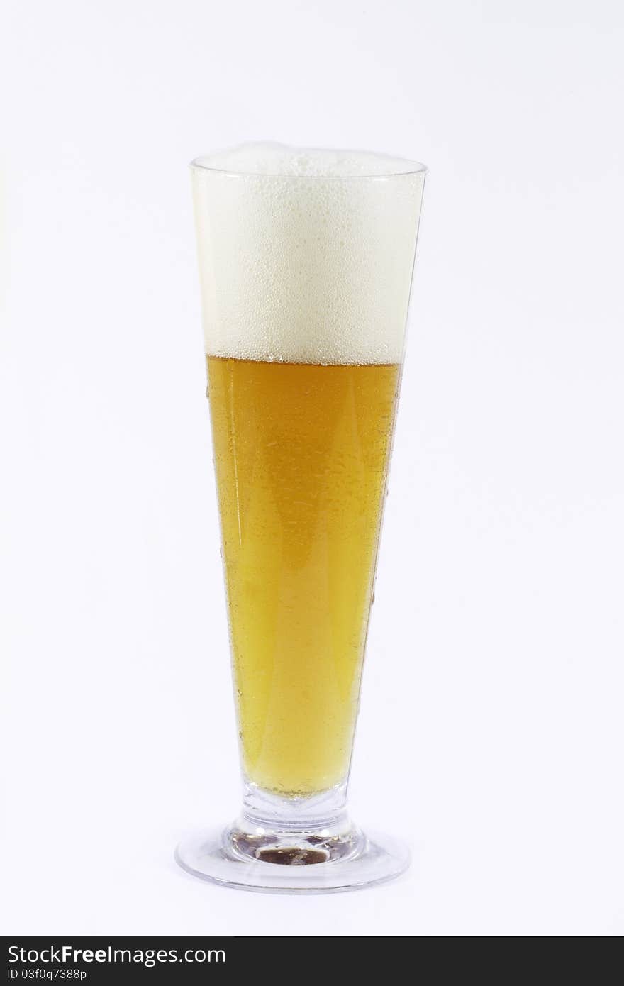 Glass of dark beer on white background