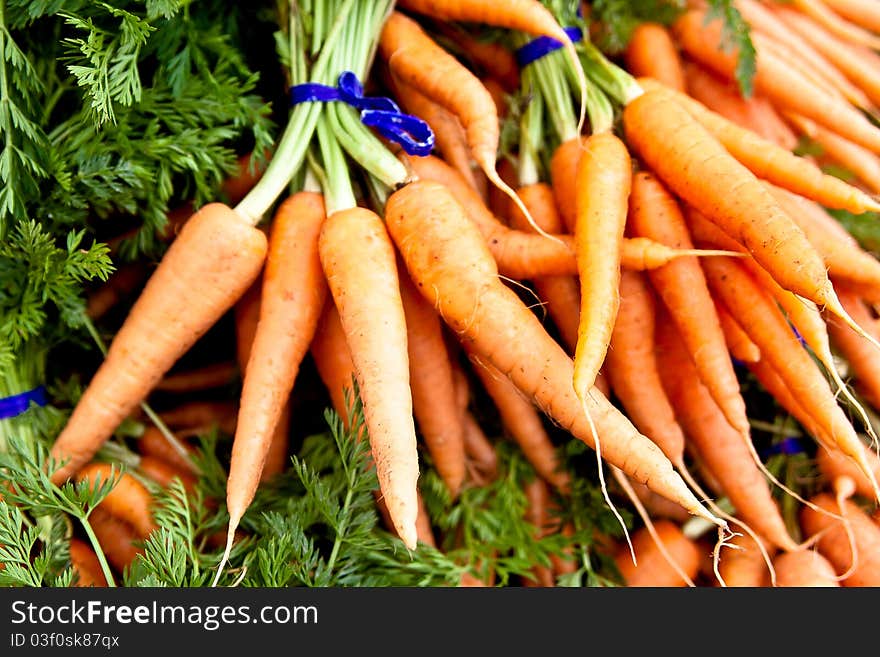 Carrots on display at a local farmers market. Carrots on display at a local farmers market