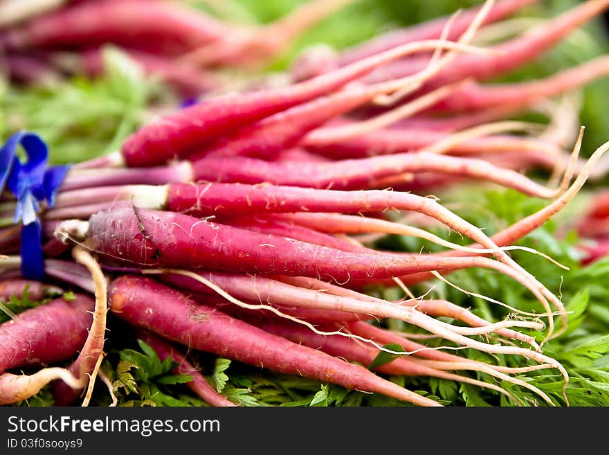 Purple vegetable roots at a local farmers market. Purple vegetable roots at a local farmers market.