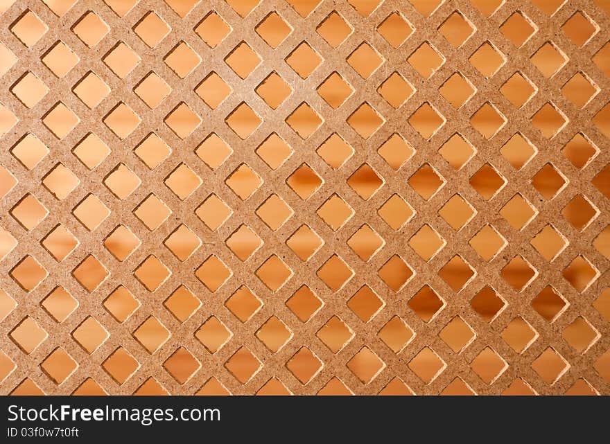 Slab of fiberboard with rhomb perforations. Slab of fiberboard with rhomb perforations