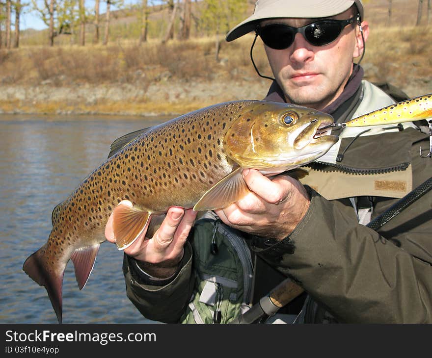 Fishing - fisherman catched big trout