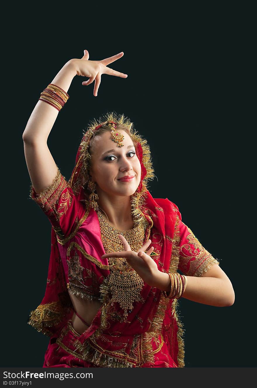 Young woman in red rich oriental  indian costume