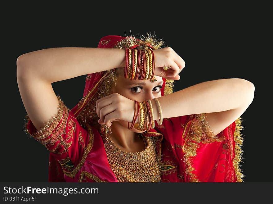 Young girl in red indian costume closeup portrait