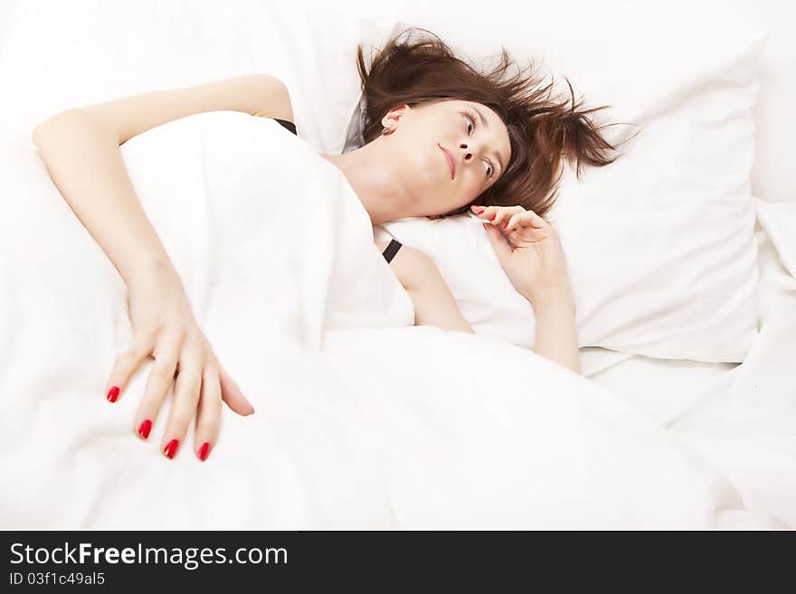 Portrait Of A Brunette In Bed