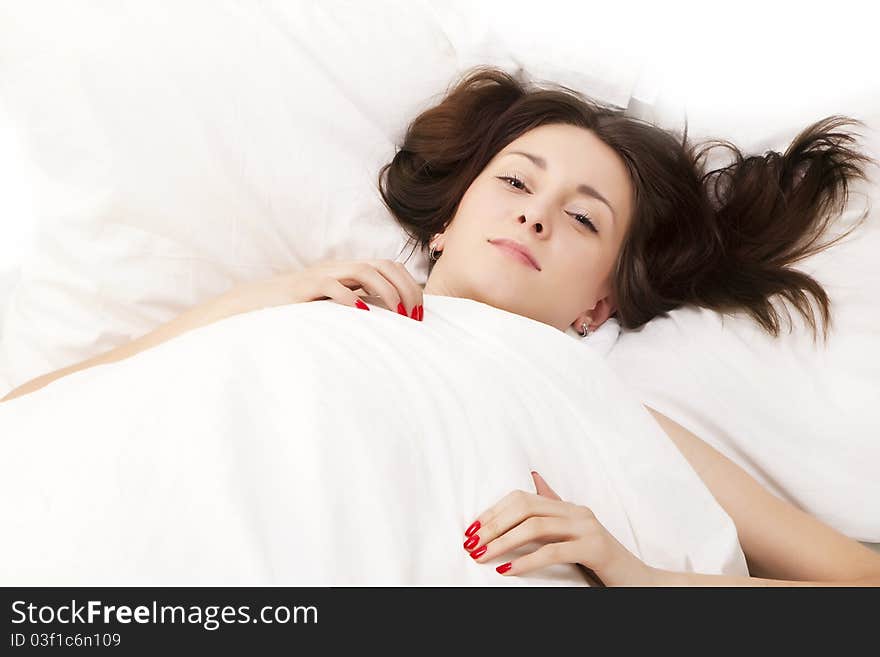 Portrait of a adult brunette in bed. Portrait of a adult brunette in bed