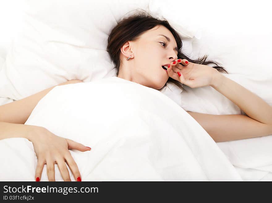 Portrait of a brunette in bed