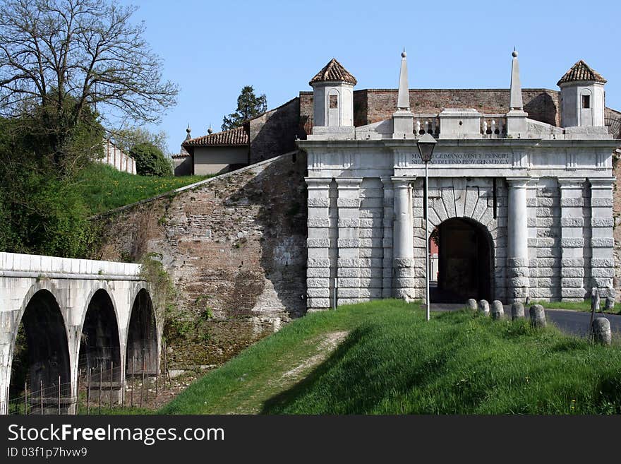 One of only three entrances to the town of Palmanova, a walled city in form of a star.This entry is the most characteristic, with Venetian aqueduct on the left. One of only three entrances to the town of Palmanova, a walled city in form of a star.This entry is the most characteristic, with Venetian aqueduct on the left.