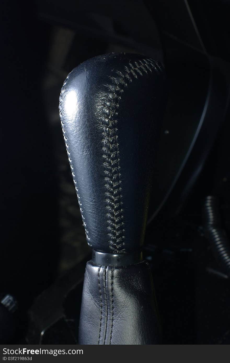 Black leather car gear stick. Black leather car gear stick